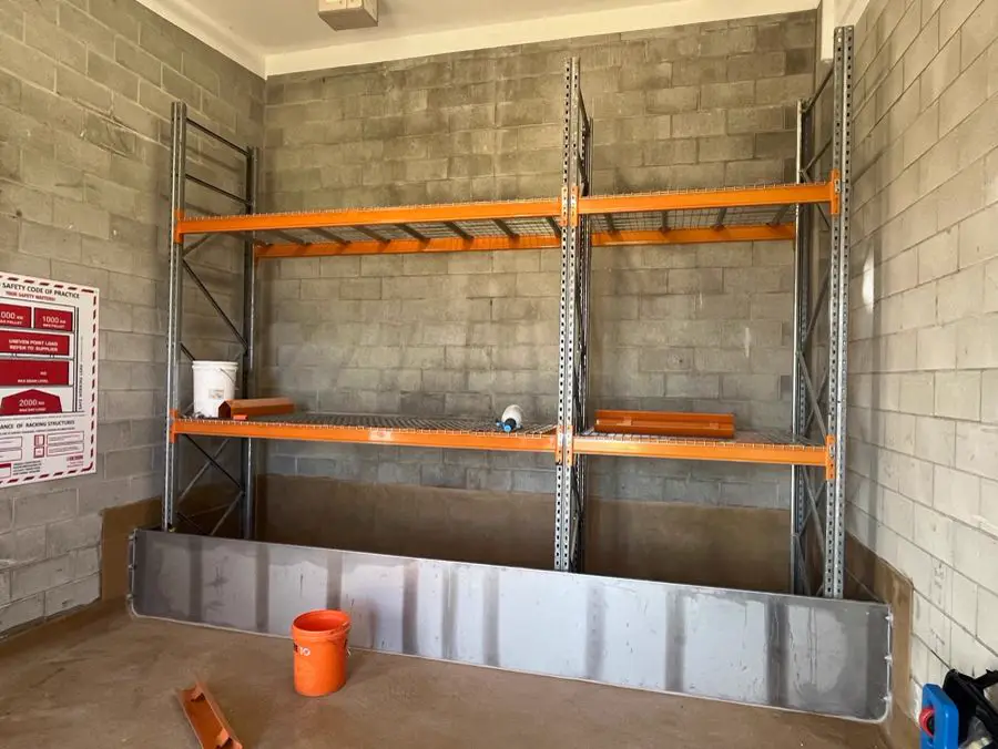 Lined chemical containment bund with steel racking